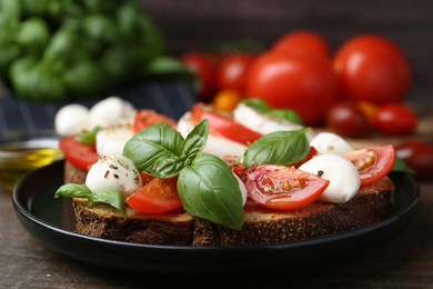 Photo of Tasty sandwiches with mozzarella cheese, tomatoes, basil and spices on wooden table, closeup