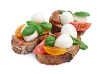 Photo of Tasty sandwiches with mozzarella cheese, tomatoes and basil isolated on white