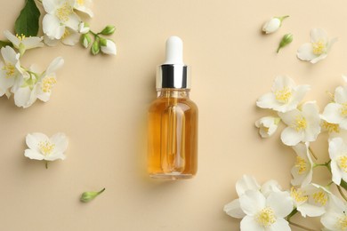 Photo of Essential oil and beautiful jasmine flowers on beige background, flat lay