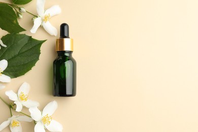 Photo of Essential oil, beautiful jasmine flowers and green leaves on beige background, flat lay. Space for text