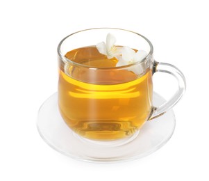 Photo of Aromatic jasmine tea in glass cup and flowers isolated on white