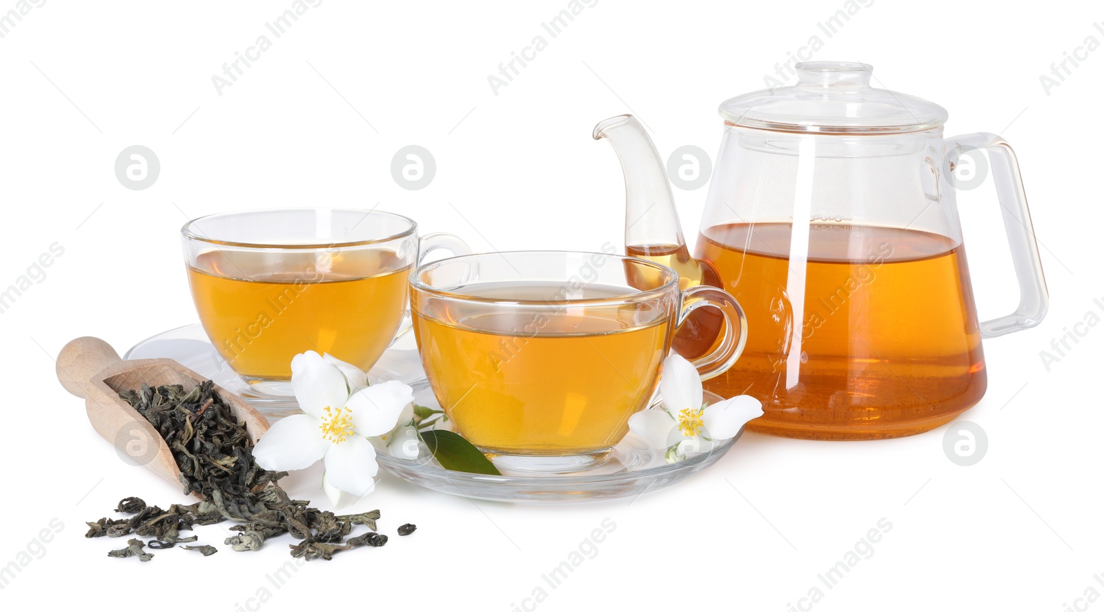 Aromatic jasmine tea in glass cups, teapot, flowers and dried leaves isolated on white Photo of Aromatic jasmine tea in glass cups, teapot, flowers and dried leaves isolated on white