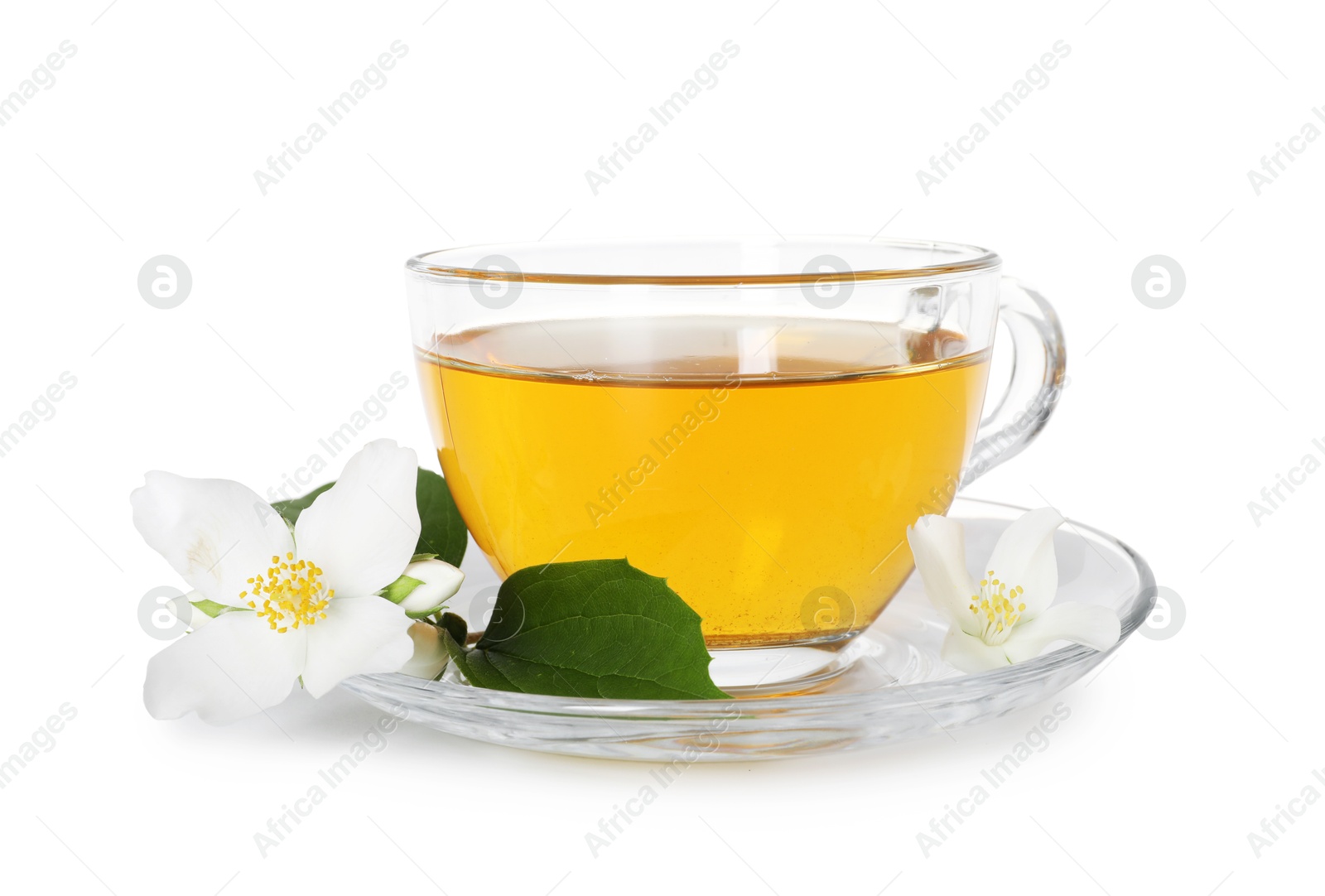 Aromatic jasmine tea in glass cup, flowers and green leaves isolated on white Photo of Aromatic jasmine tea in glass cup, flowers and green leaves isolated on white