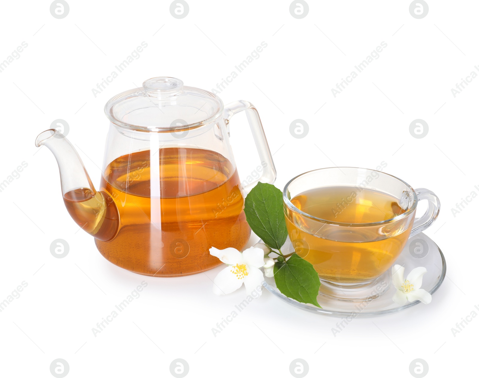 Aromatic jasmine tea in glass cup, teapot and flowers isolated on white Photo of Aromatic jasmine tea in glass cup, teapot and flowers isolated on white