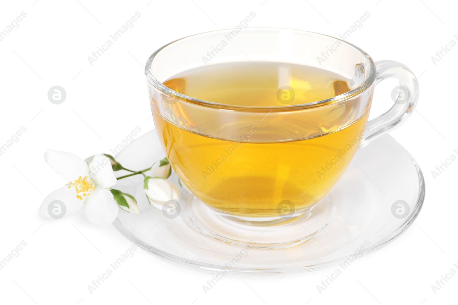 Aromatic jasmine tea in glass cup and flowers isolated on white Photo of Aromatic jasmine tea in glass cup and flowers isolated on white