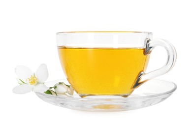 Photo of Aromatic jasmine tea in glass cup and flowers isolated on white
