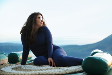 Photo of Beautiful woman enjoying picturesque view of mountains. Space for text