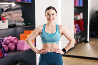Photo of Beautiful woman wearing sportswear in fitness studio
