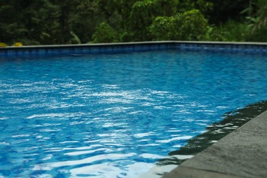 Photo of Outdoor swimming pool with clear water, closeup
