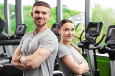 Photo of Portrait of personal trainers in sport center