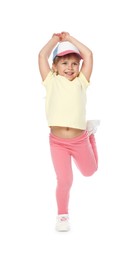 Photo of Happy little girl in baseball hat dancing on white background