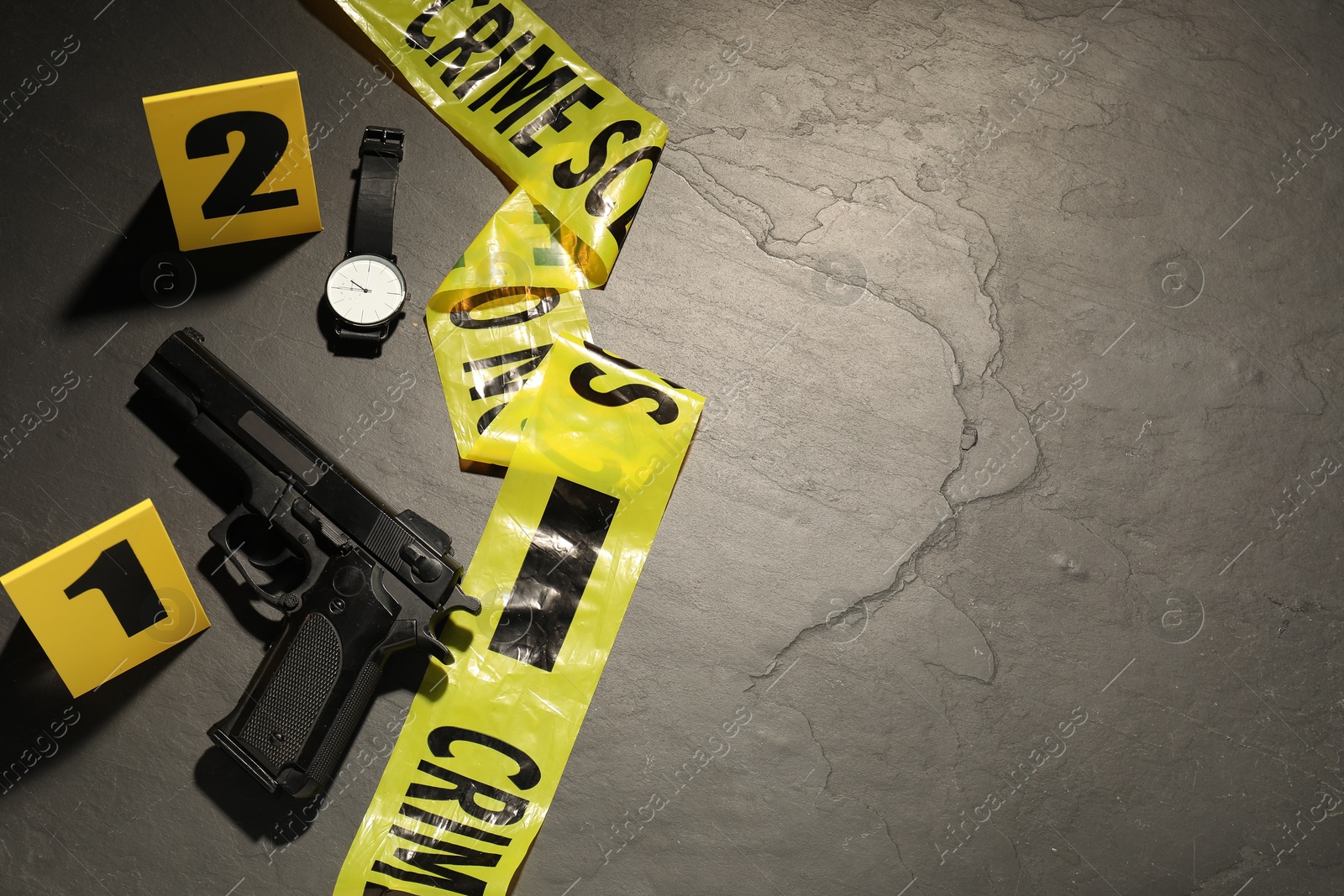 Forensic expertise. Crime scene with evidence, markers and police tape on grey background, flat lay. Space for text Photo of Forensic expertise. Crime scene with evidence, markers and police tape on grey background, flat lay. Space for text