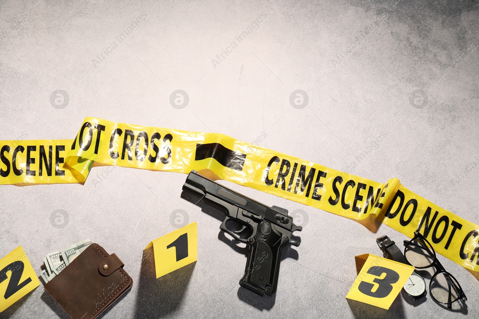 Forensic expertise. Crime scene with evidence, markers and police tape on light grey background, flat lay. Space for text Photo of Forensic expertise. Crime scene with evidence, markers and police tape on light grey background, flat lay. Space for text