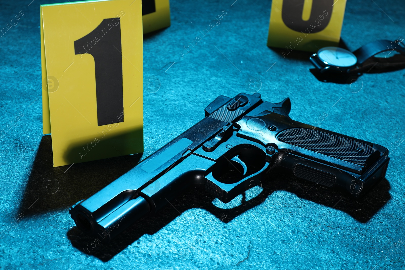 Forensic expertise. Crime scene with evidence, markers and police tape on blue background, closeup. Color toned effect Photo of Forensic expertise. Crime scene with evidence, markers and police tape on blue background, closeup. Color toned effect