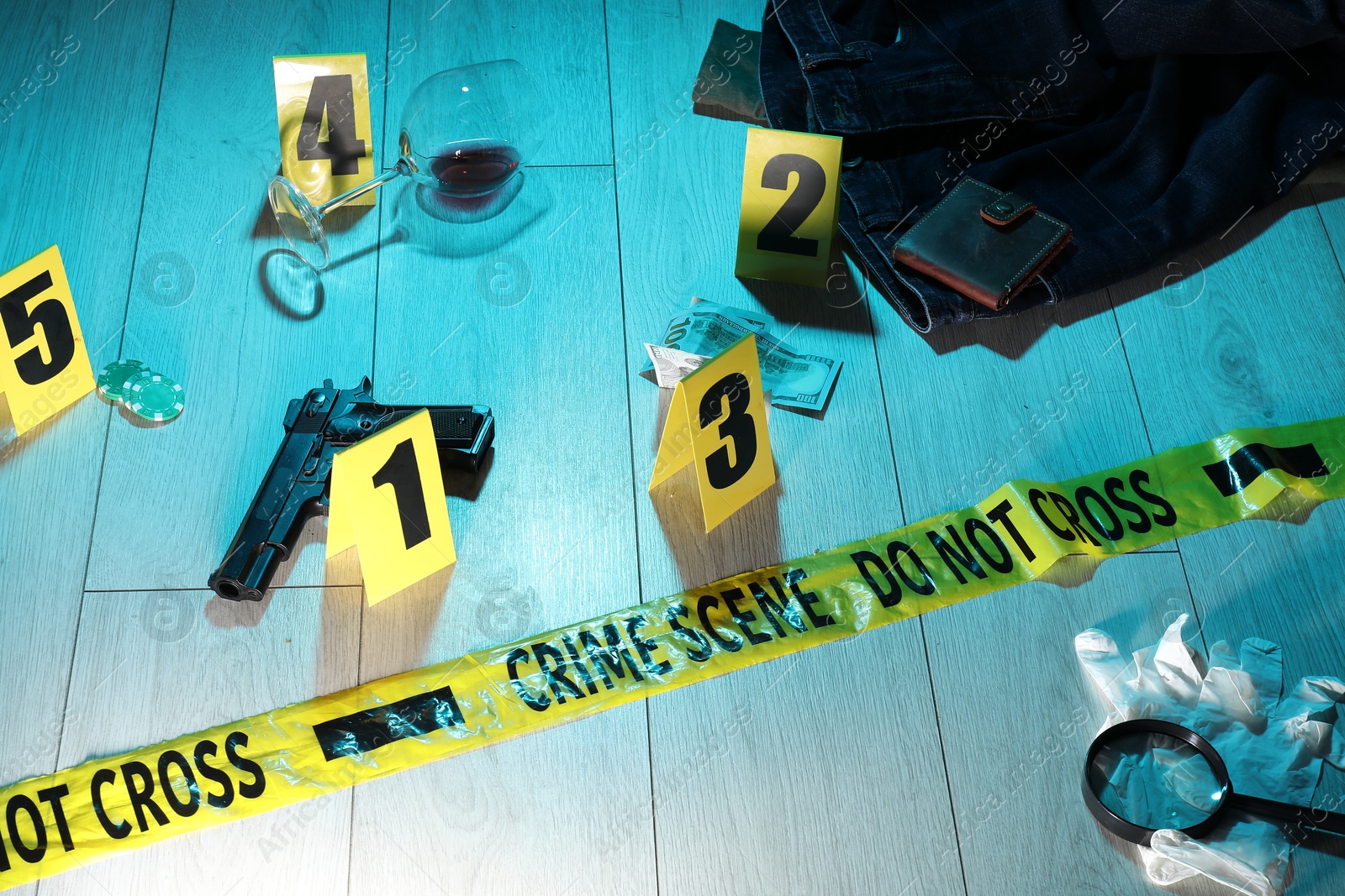Forensic expertise. Crime scene with evidence, markers and police tape on floor. Color toned effect Photo of Forensic expertise. Crime scene with evidence, markers and police tape on floor. Color toned effect
