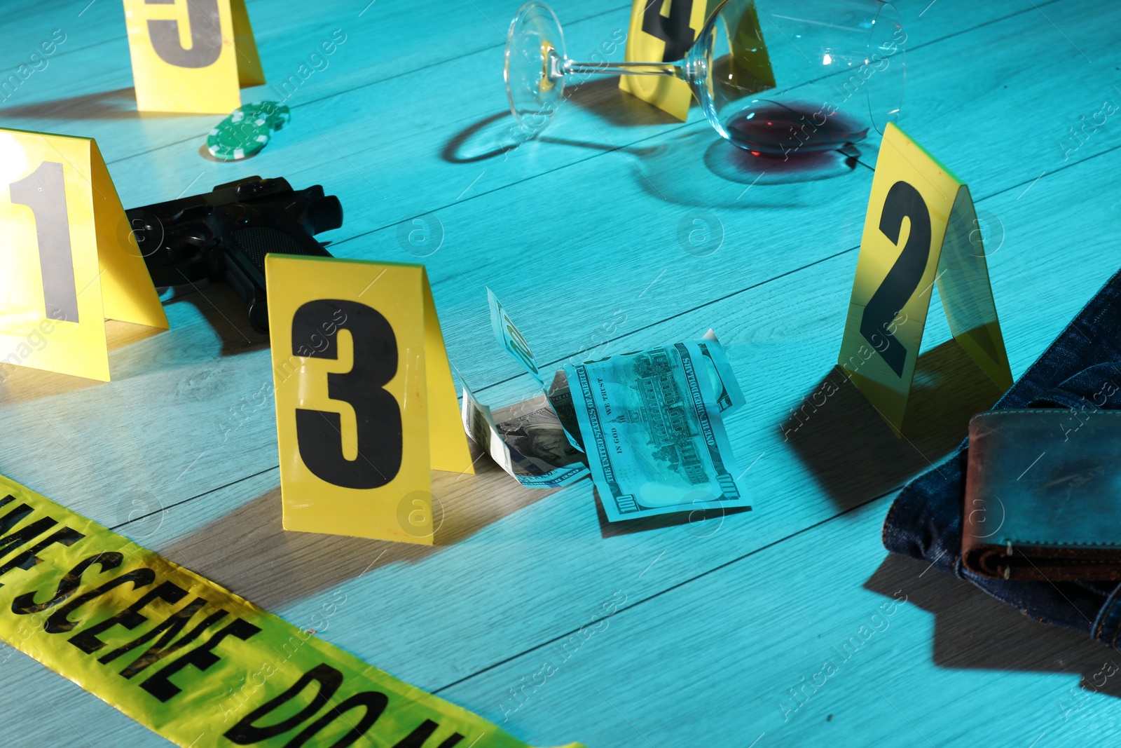 Forensic expertise. Crime scene with evidence, markers and police tape on floor, closeup. Color toned effect Photo of Forensic expertise. Crime scene with evidence, markers and police tape on floor, closeup. Color toned effect