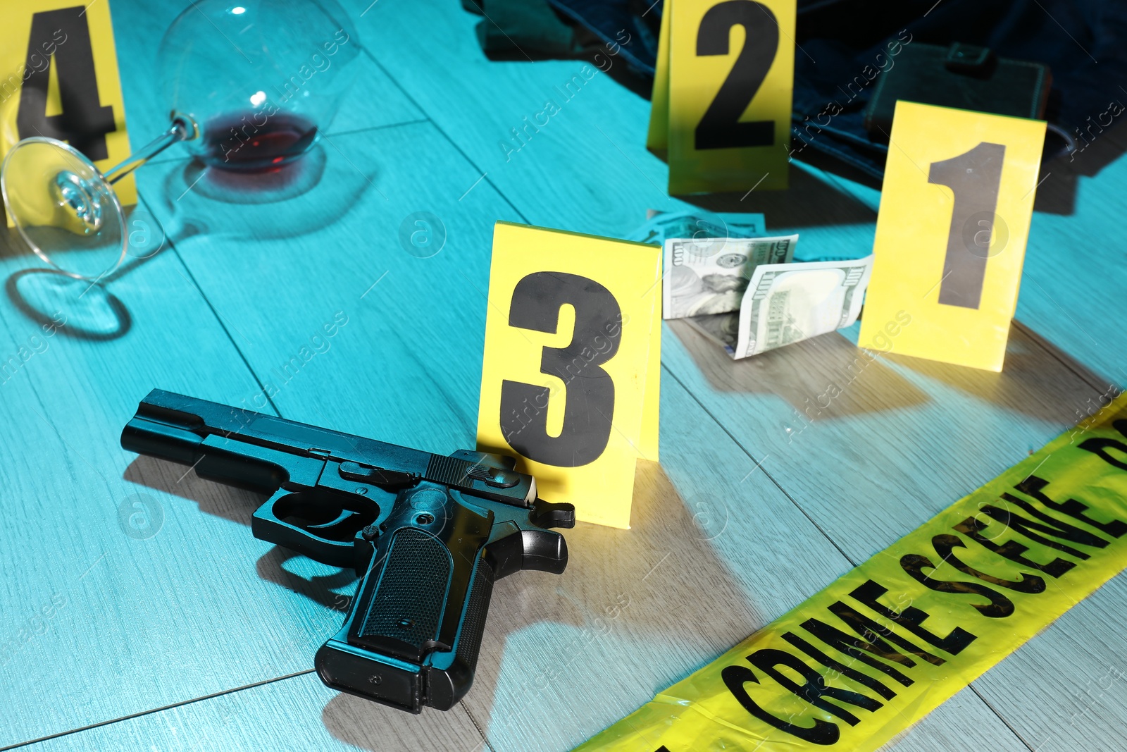 Forensic expertise. Crime scene with evidence, markers and police tape on floor, closeup. Color toned effect Photo of Forensic expertise. Crime scene with evidence, markers and police tape on floor, closeup. Color toned effect
