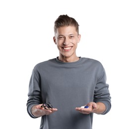 Photo of Man choosing between glasses and contact lenses on white background