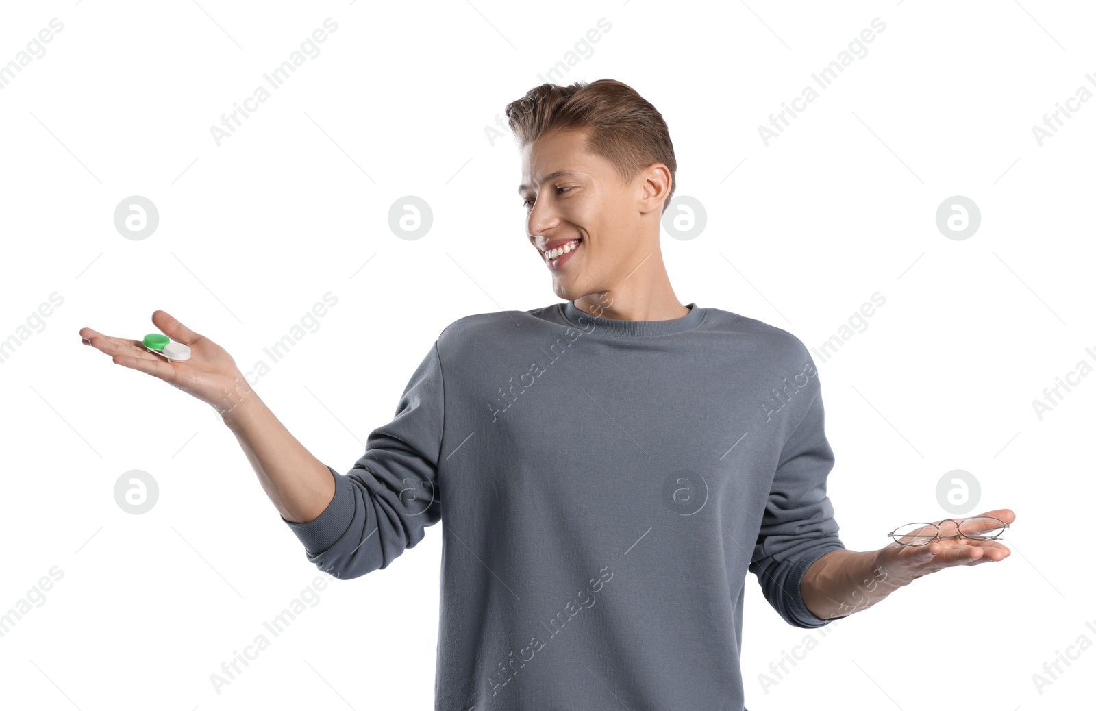 Man choosing between glasses and contact lenses on white background Photo of Man choosing between glasses and contact lenses on white background