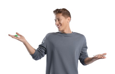 Photo of Man choosing between glasses and contact lenses on white background