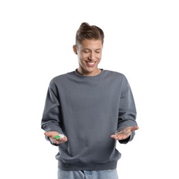 Photo of Man choosing between glasses and contact lenses on white background