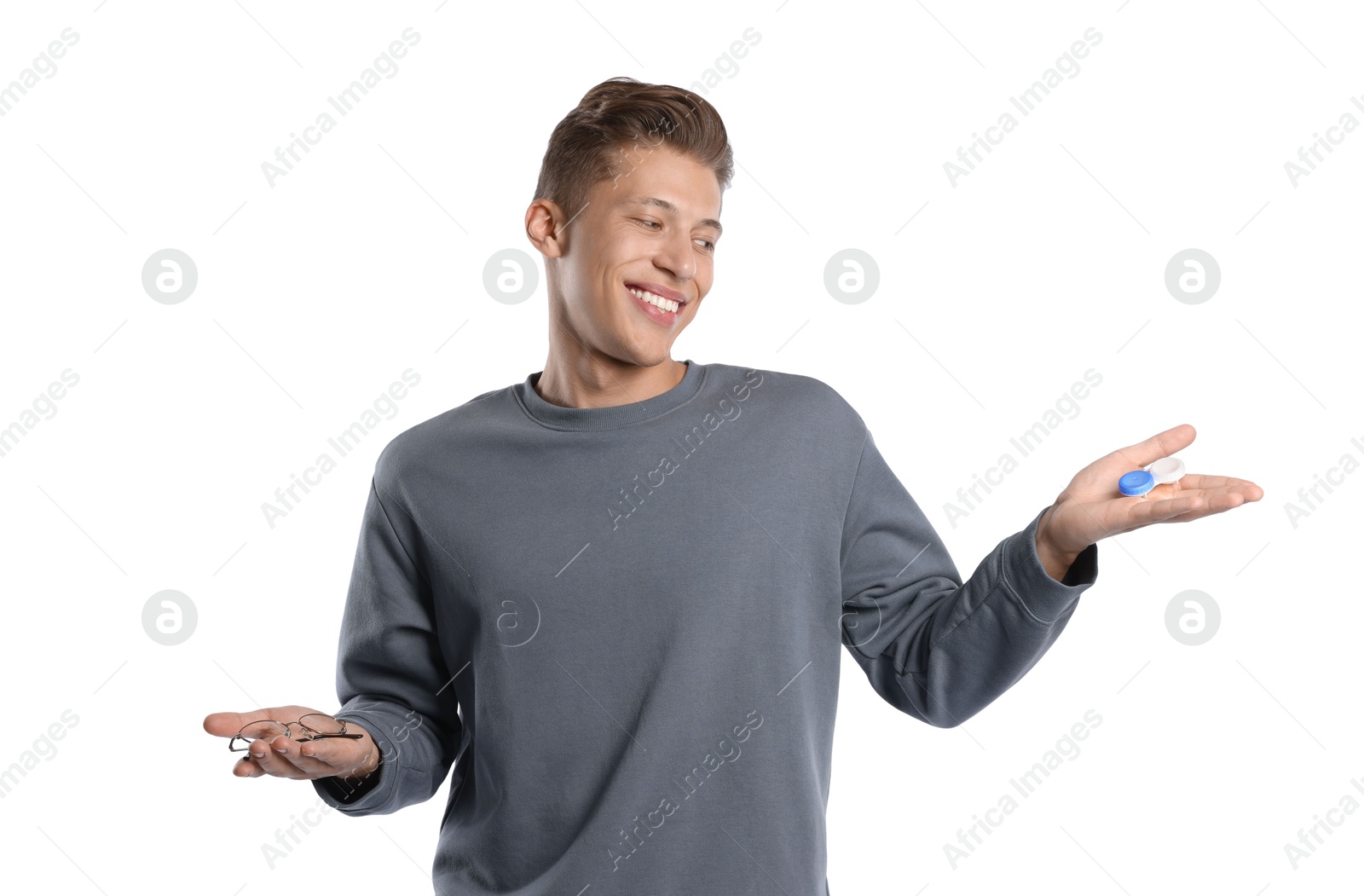 Man choosing between glasses and contact lenses on white background Photo of Man choosing between glasses and contact lenses on white background