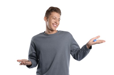 Photo of Man choosing between glasses and contact lenses on white background