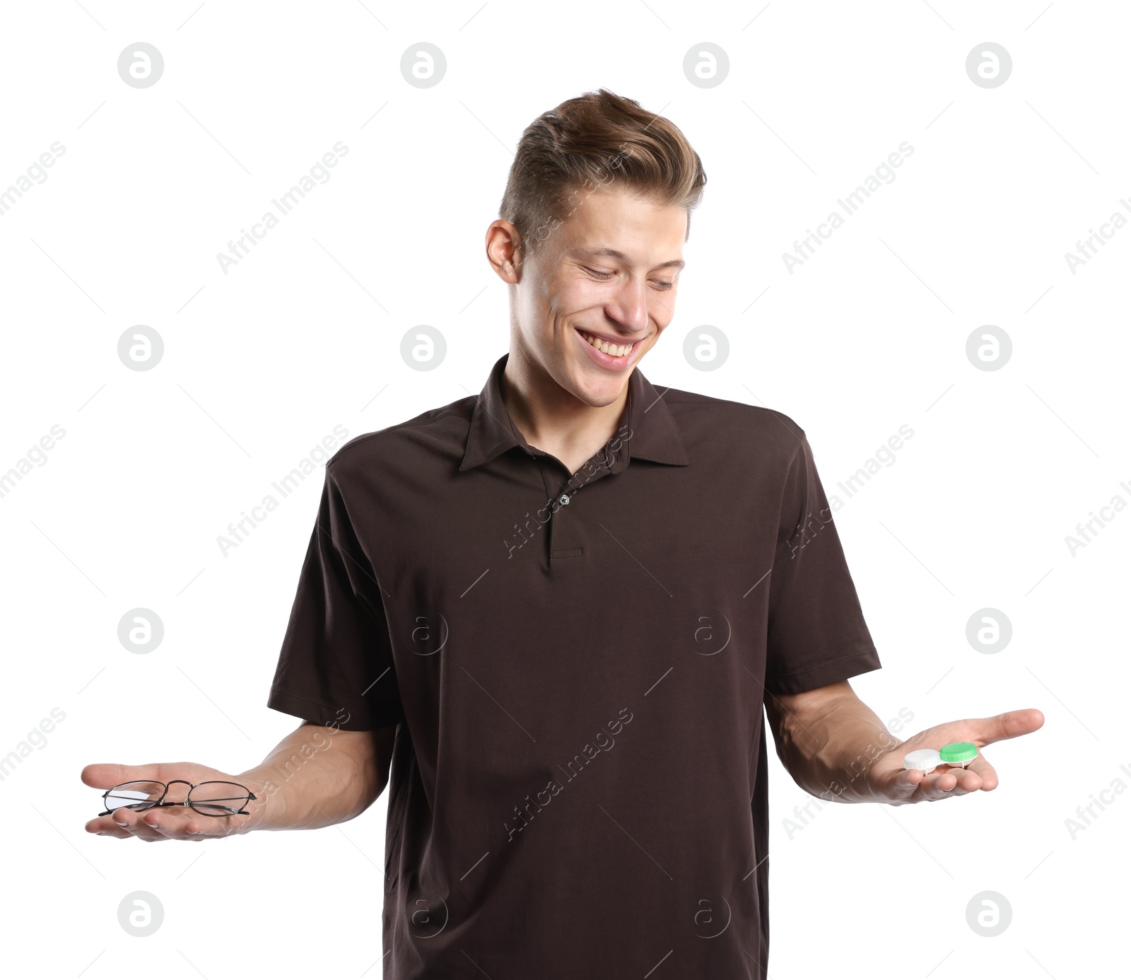 Man choosing between glasses and contact lenses on white background Photo of Man choosing between glasses and contact lenses on white background