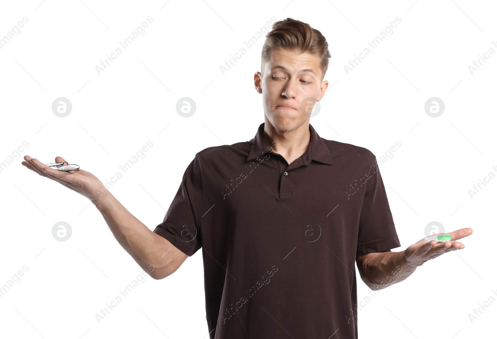 Man choosing between glasses and contact lenses on white background Photo of Man choosing between glasses and contact lenses on white background