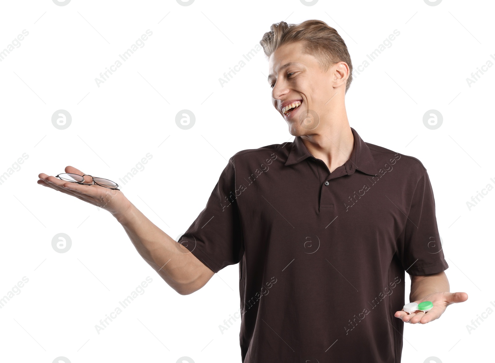 Man choosing between glasses and contact lenses on white background Photo of Man choosing between glasses and contact lenses on white background