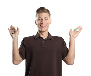 Photo of Man choosing between glasses and contact lenses on white background