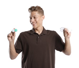 Photo of Man choosing between glasses and contact lenses on white background