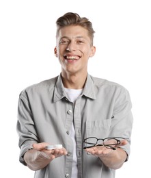 Photo of Man choosing between glasses and contact lenses on white background