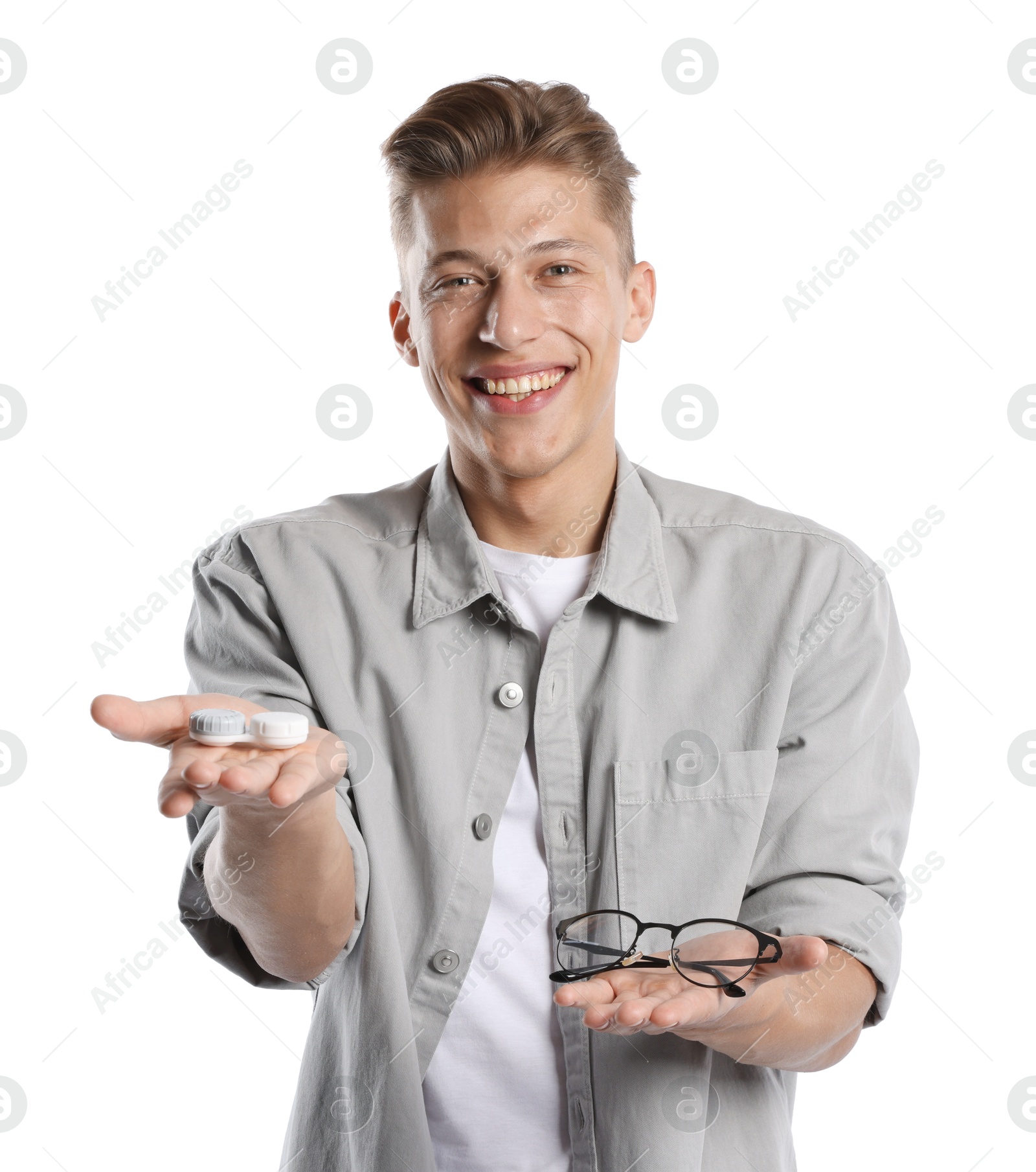 Man choosing between glasses and contact lenses on white background Photo of Man choosing between glasses and contact lenses on white background