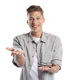 Photo of Man choosing between glasses and contact lenses on white background