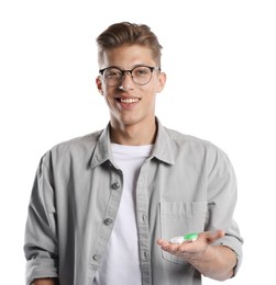 Photo of Man choosing between glasses and contact lenses on white background