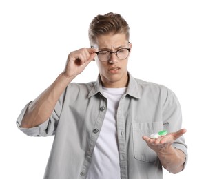 Photo of Man choosing between glasses and contact lenses on white background
