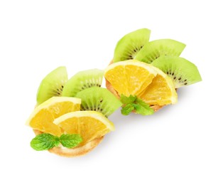Photo of Tartlets with fruits and mint isolated on white, top view. Delicious dessert