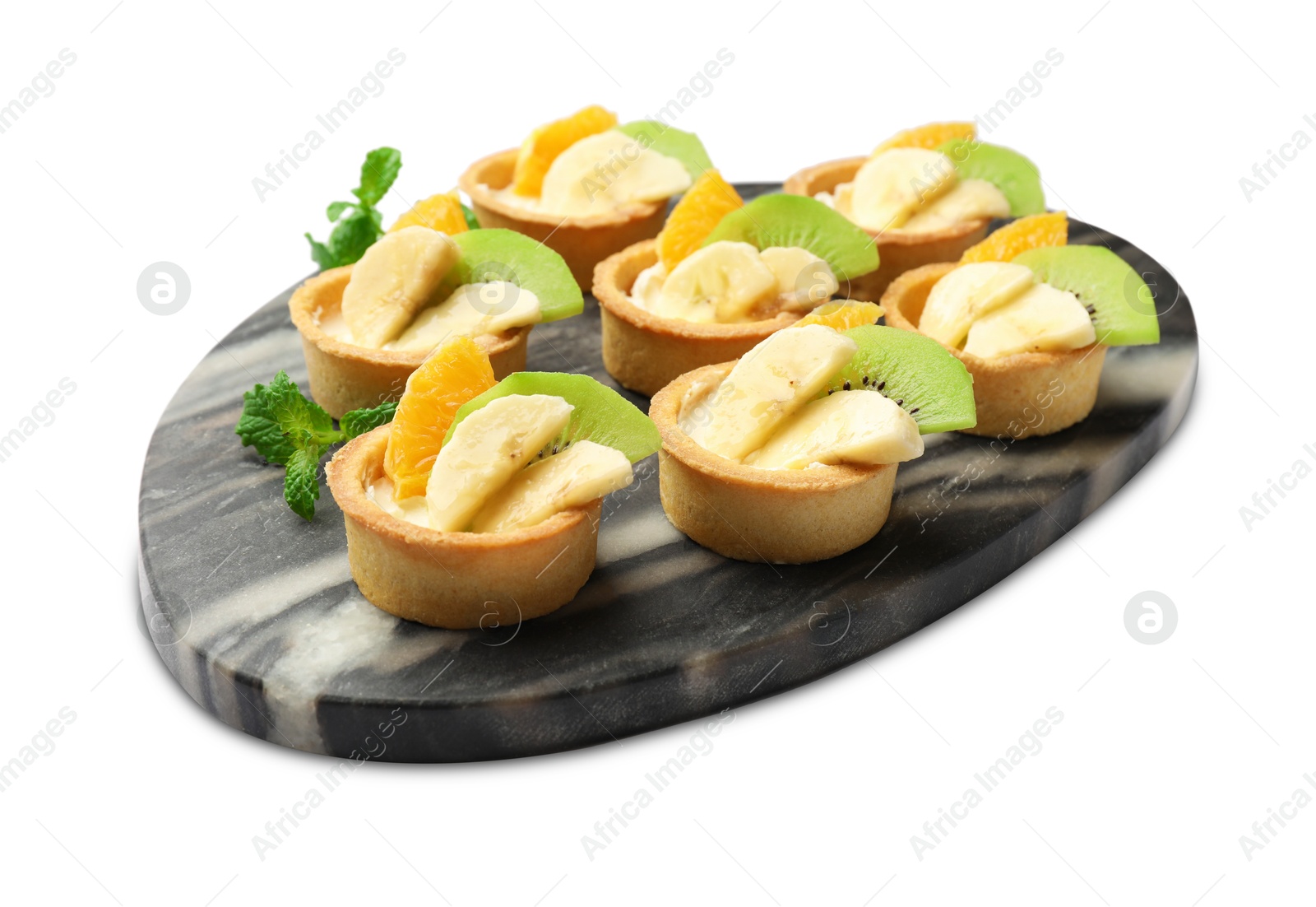 Tartlets with fruits and mint isolated on white. Delicious dessert Photo of Tartlets with fruits and mint isolated on white. Delicious dessert