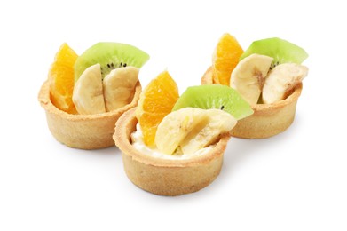 Photo of Tartlets with fruits isolated on white. Delicious dessert