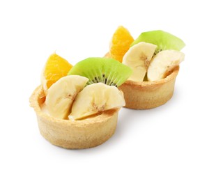 Photo of Tartlets with fruits isolated on white. Delicious dessert