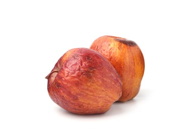 Photo of Two whole rotten apples isolated on white