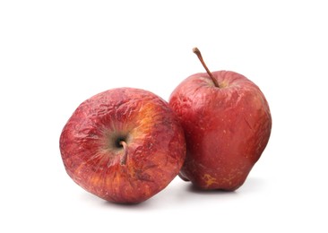 Photo of Two whole rotten apples isolated on white