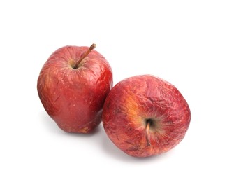 Photo of Two whole rotten apples isolated on white