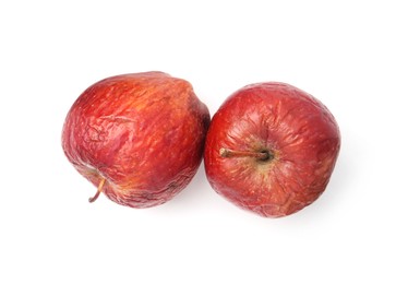 Photo of Rotten apples isolated on white, top view