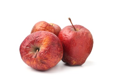 Photo of Many whole rotten apples isolated on white