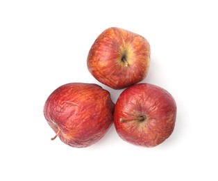 Photo of Rotten apples isolated on white, top view
