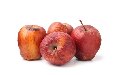 Photo of Many whole rotten apples isolated on white