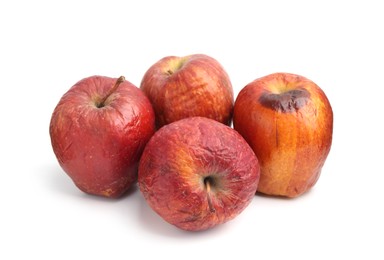 Photo of Many whole rotten apples isolated on white