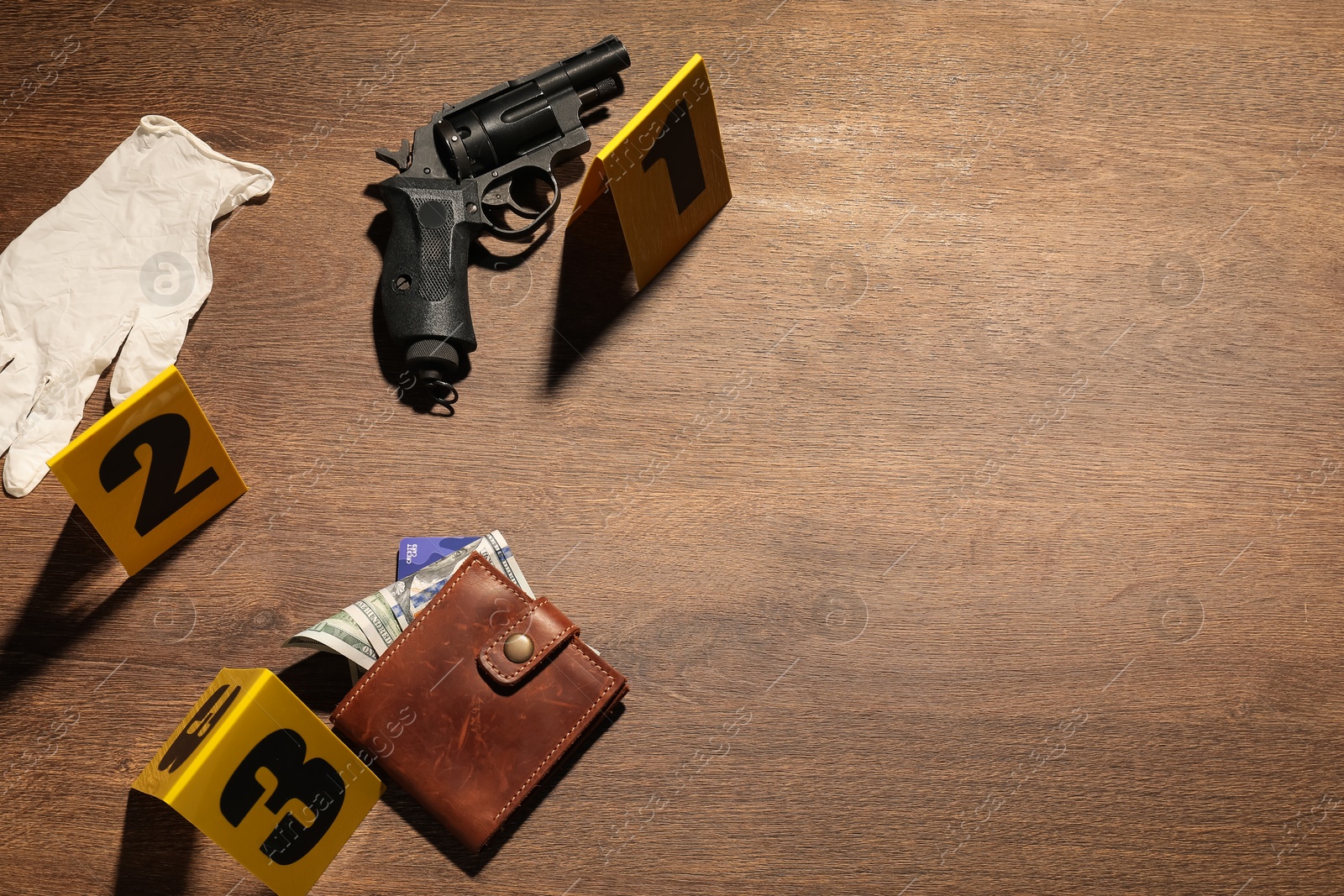 Forensic expertise. Crime scene with evidence, markers and police tape on wooden background, flat lay. Space for text Photo of Forensic expertise. Crime scene with evidence, markers and police tape on wooden background, flat lay. Space for text